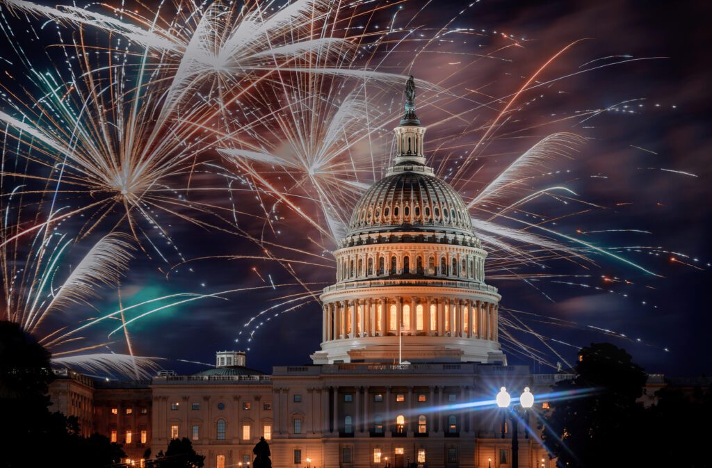 July 4th Independence day show cheerful fireworks display on the US Capitol Building in Washington DC USA