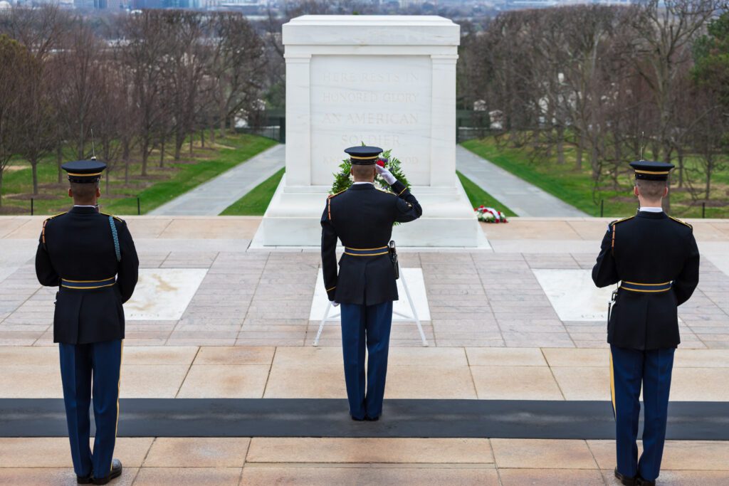 U.S. Military Honor Guard laying a wreath at The Tomb of the Unknown Soldier in Arlington National Cemetery.