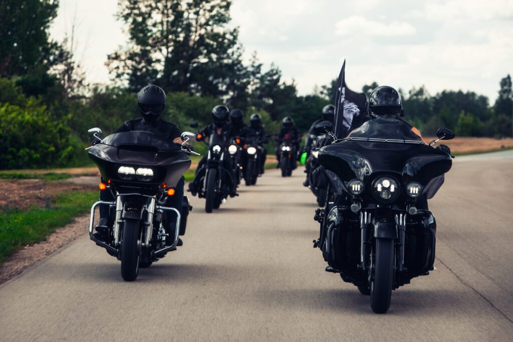 Group of motorcycle riders on a highway.