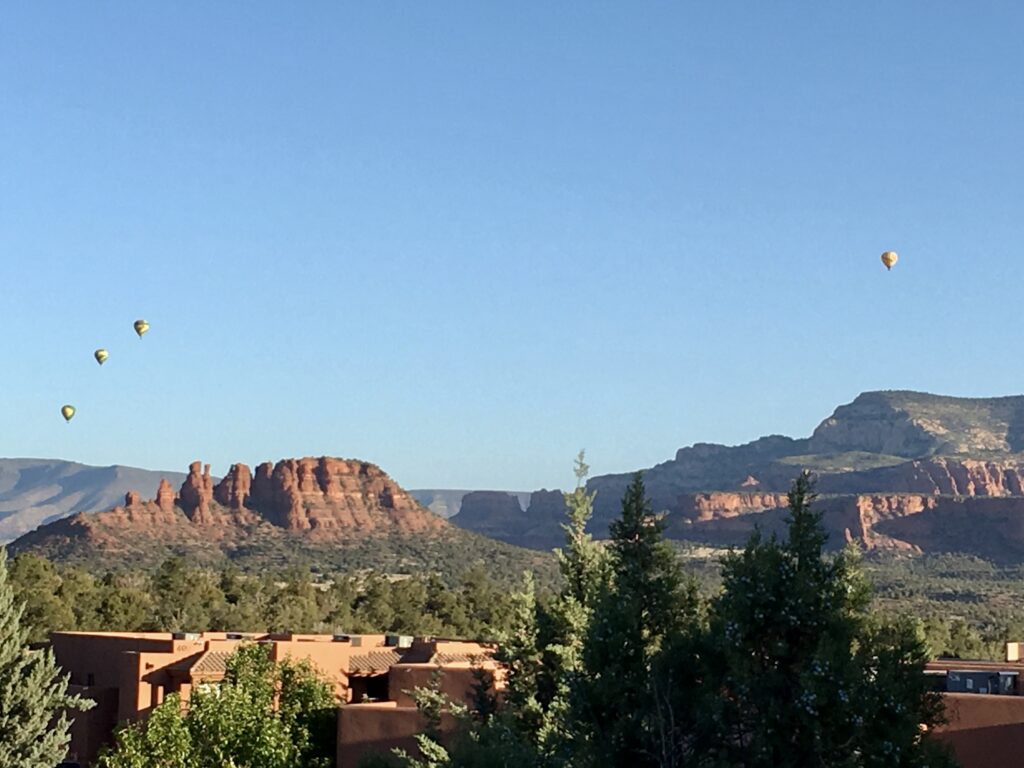 Hot air balloons flying over Sedona, Arizona.