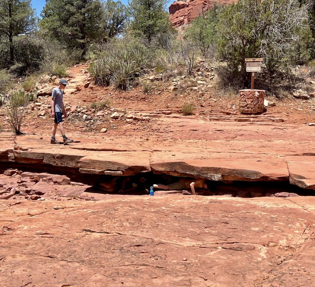 Finding shade in the dry creek bed at the four-way intersection of Big Park Loop and Courthouse Butte Loop Trail.