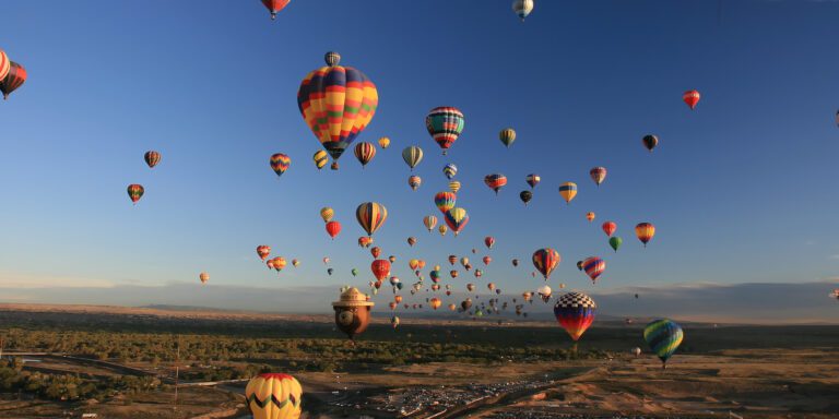 Hundreds of hot-air balloons takeoff each morning and land around various parts of Albuquerque, New Mexico just in time to pack them up and go to brunch.